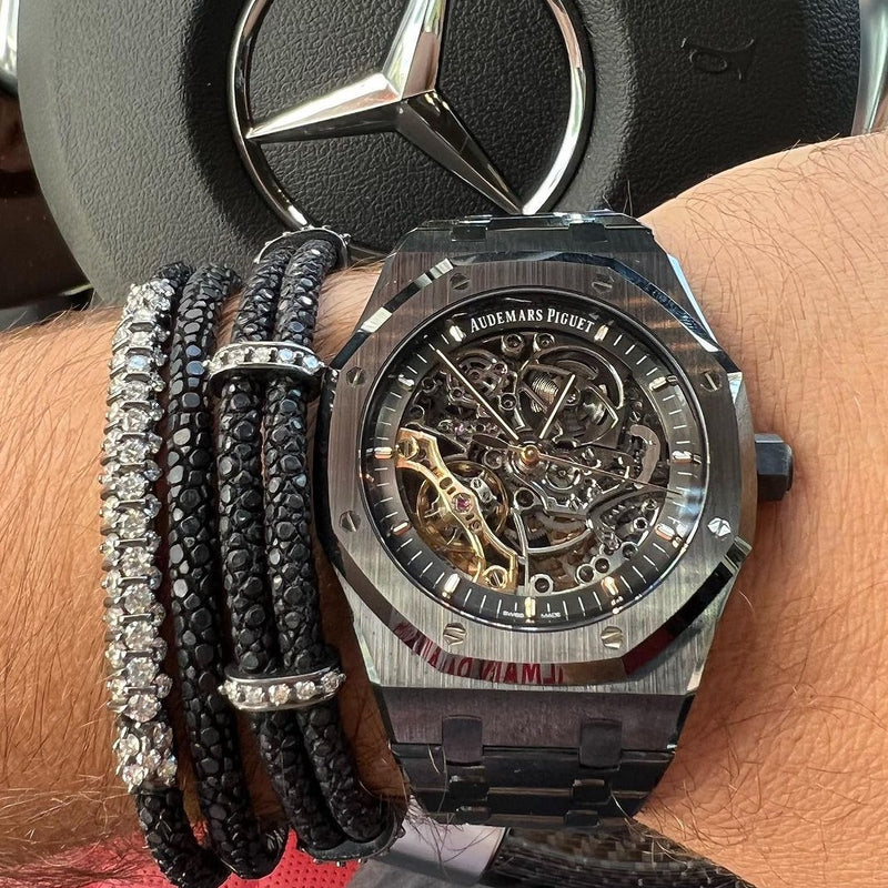 StingHD B472 bracelet highlighting a meticulously handcrafted black platinum-plated silver design, adorned with a shimmering white diamond bar, sophisticatedly showcased by (IG: SPJeweler).